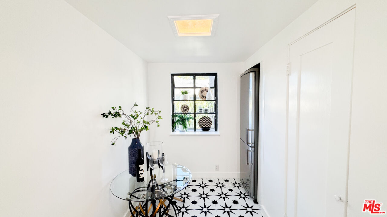 13529 Beverly Boulevard Whittier, CA 90601 - Photo 24 of 54 a view of a hallway with wooden floor and a potted plant