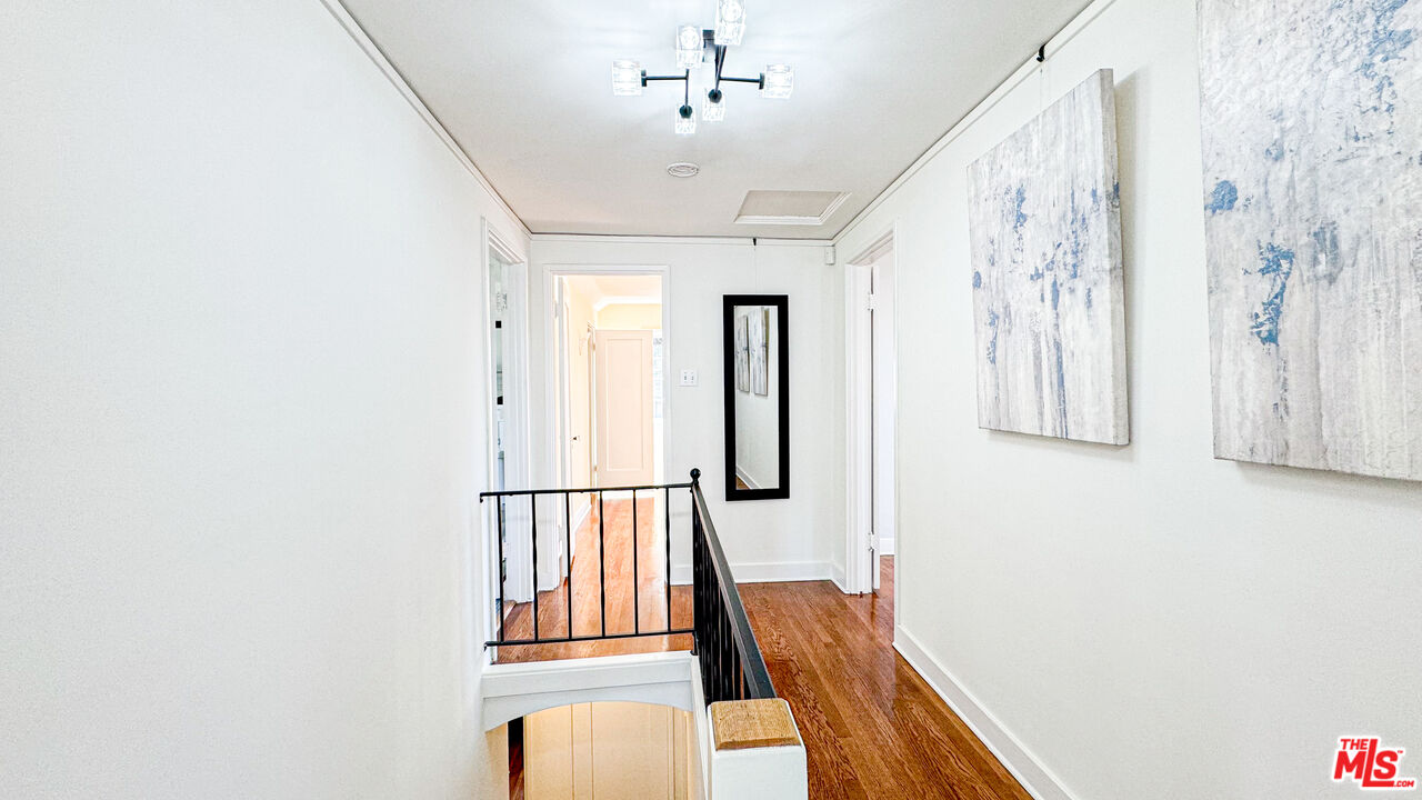 13529 Beverly Boulevard Whittier, CA 90601 - Photo 30 of 54 a view of a hallway with entryway wooden floor and front door