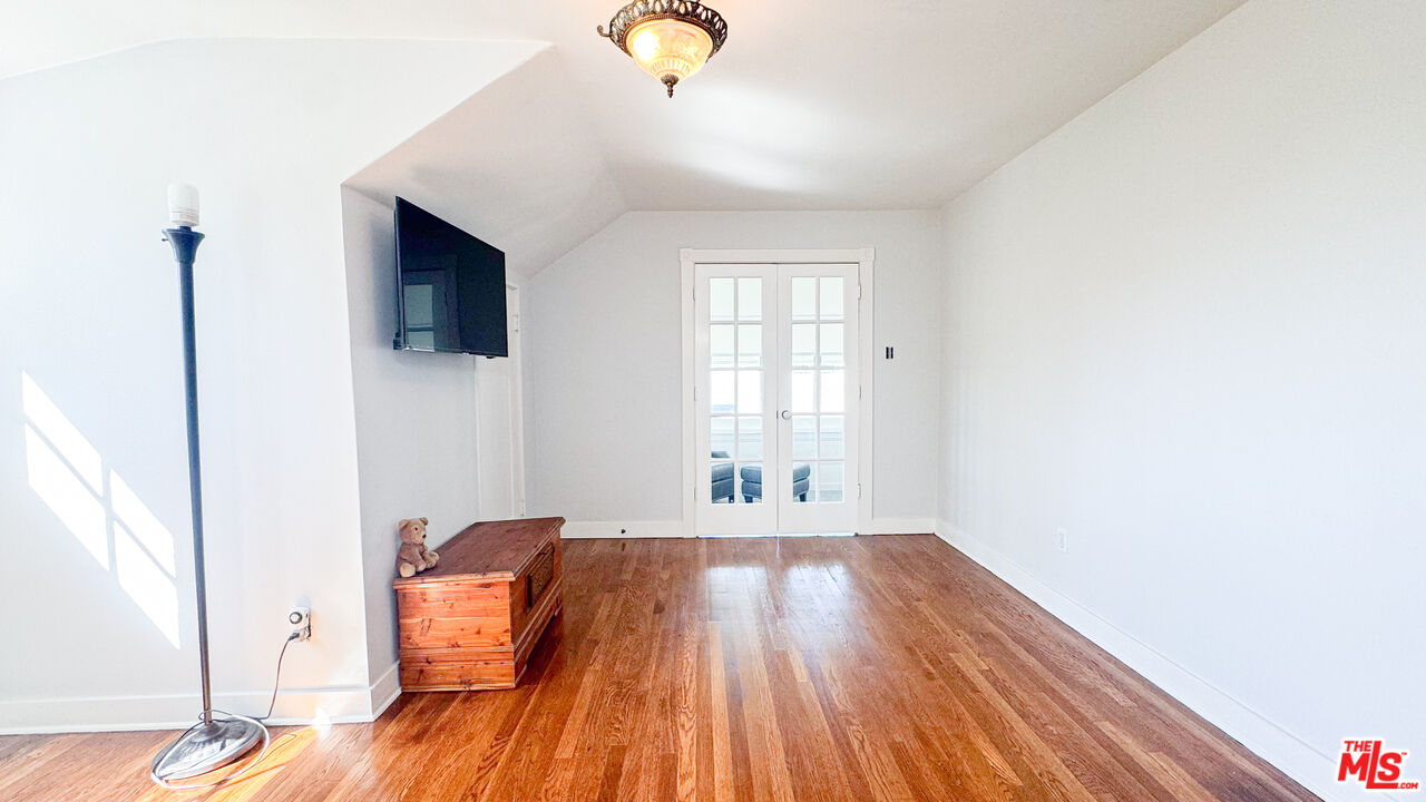 13529 Beverly Boulevard Whittier, CA 90601 - Photo 44 of 54 a view of a livingroom with wooden floor and a flat screen tv