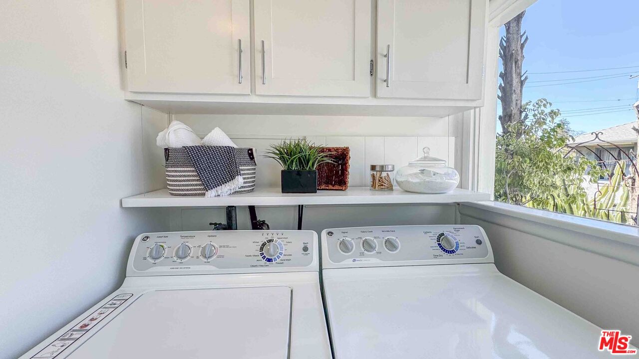 13529 Beverly Boulevard Whittier, CA 90601 - Photo 50 of 54 a kitchen with a stove and a white wooden cabinets