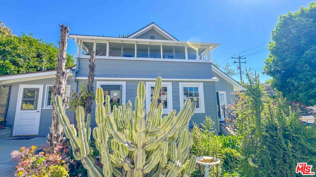 13529 Beverly Boulevard Whittier, CA 90601 - Photo 53 of 54 a front view of a house with a garden