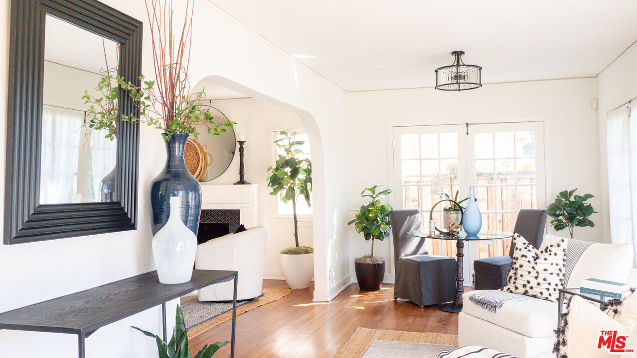 13529 Beverly Boulevard Whittier, CA 90601 - Photo 9 of 54 a living room with furniture a chandelier and a window