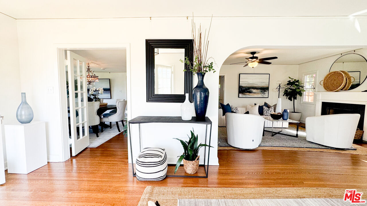 13529 Beverly Boulevard Whittier, CA 90601 - Photo 10 of 54 a living room with furniture and a wooden floor