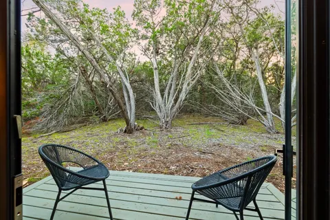 a bathroom with a double vanity sink and mirror