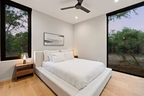 a building outdoor space with patio furniture and potted plants
