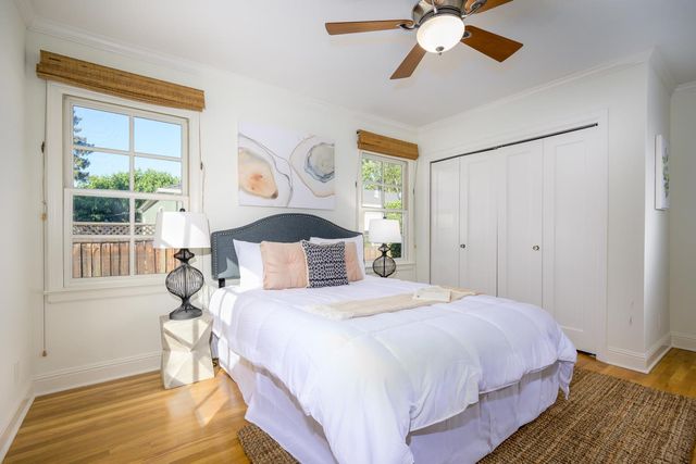 a bedroom with a large bed and a window