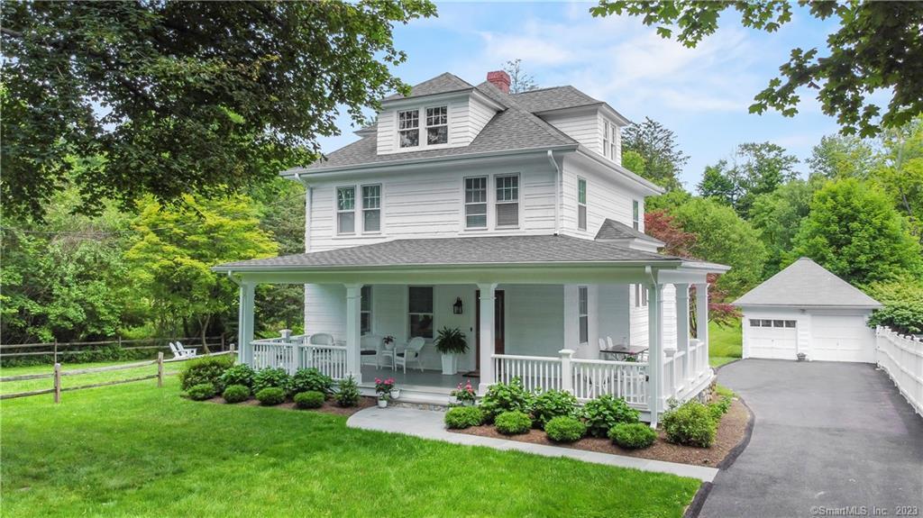 1333 Rock Rimmon Road Stamford, CT 06903 - Photo 1 of 1 a front view of a house with a yard and green space
