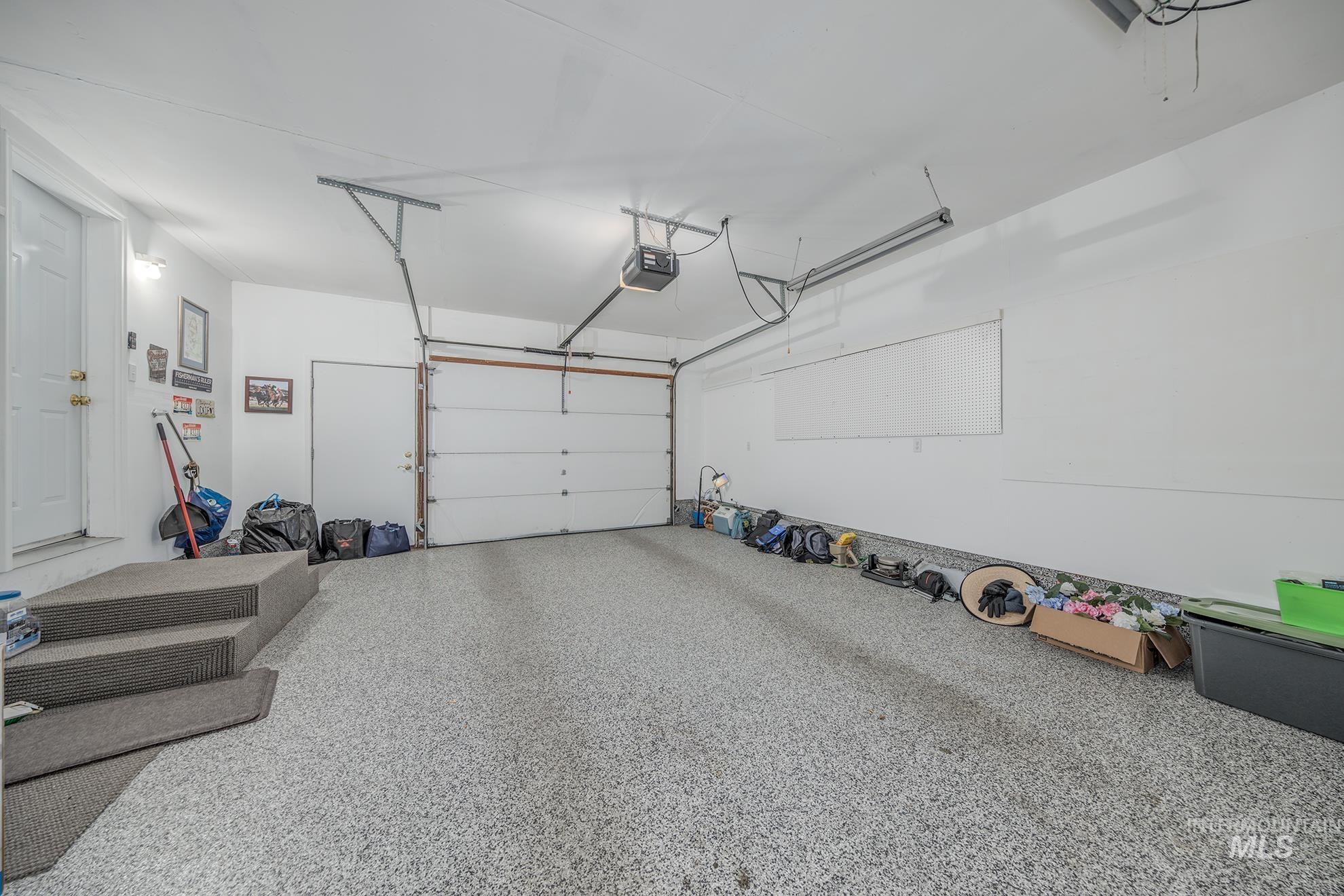 2750 Alden Road, Unit 27 Fruitland, ID 83619 - Photo 32 of 45 Garage featuring a garage door opener