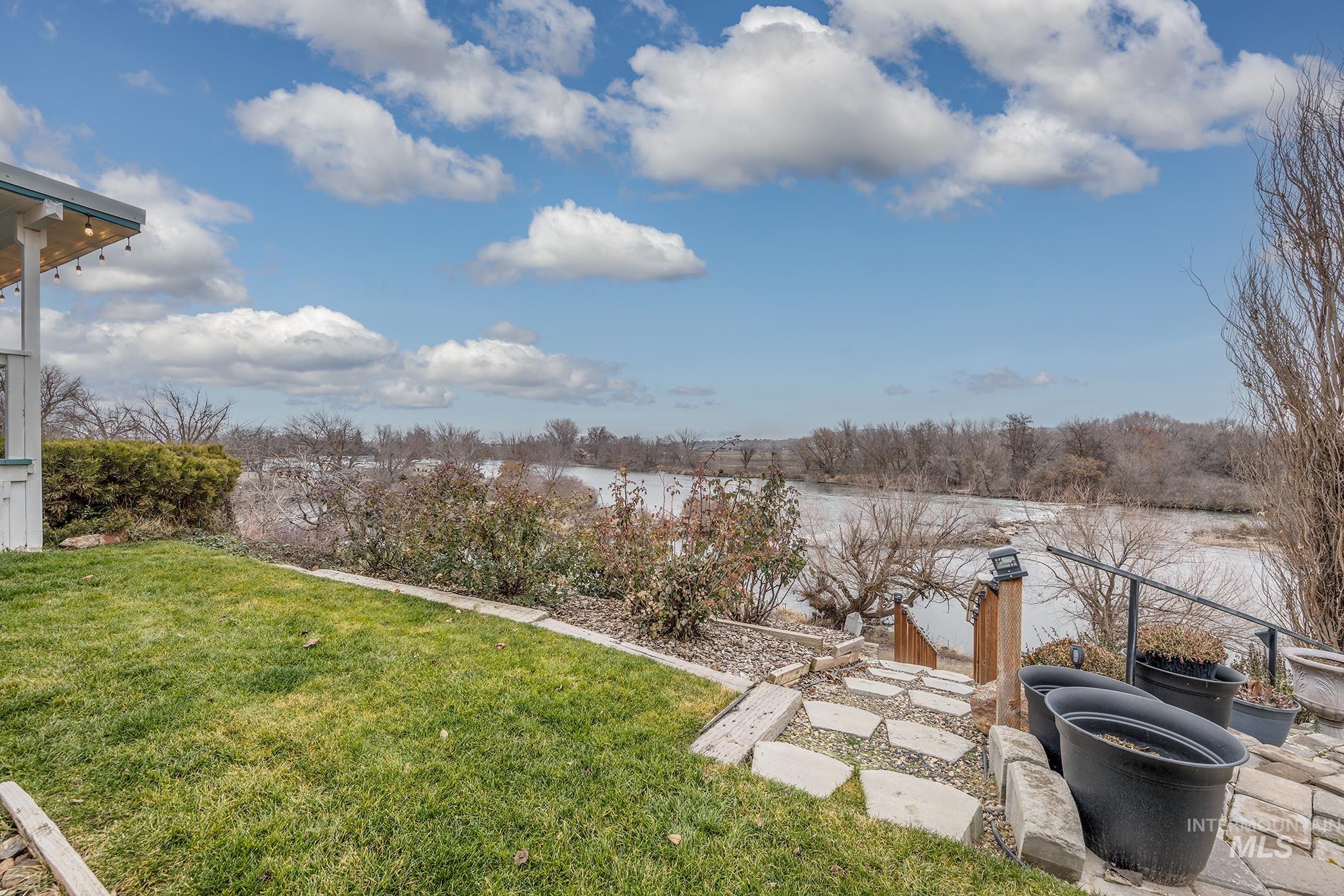 2750 Alden Road, Unit 27 Fruitland, ID 83619 - Photo 38 of 45 View of grassy yard featuring a water view and a patio area
