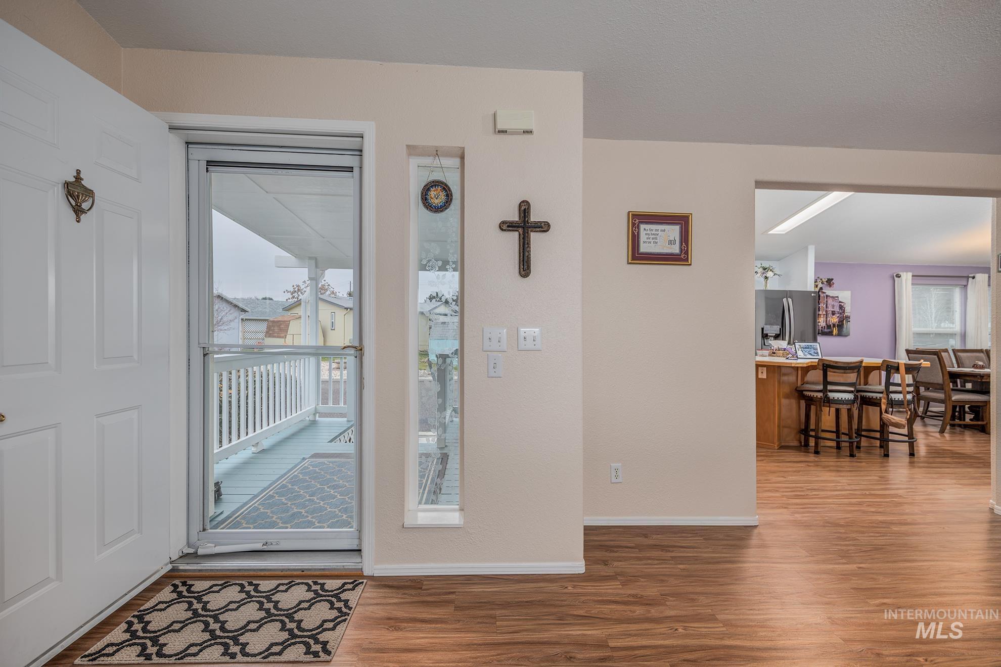 2750 Alden Road, Unit 27 Fruitland, ID 83619 - Photo 7 of 45 Foyer featuring wood finished floors and healthy amount of natural light