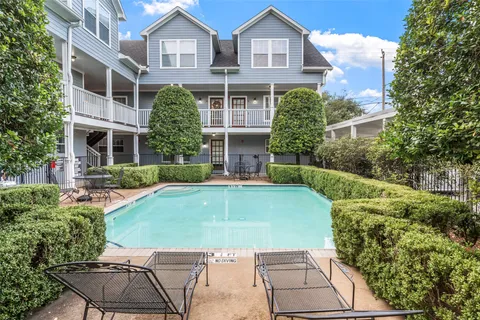 a kitchen with granite countertop stainless steel appliances a refrigerator a stove a sink and a refrigerator