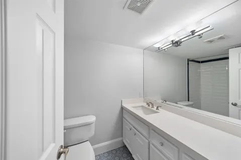 a view of a building with a yard