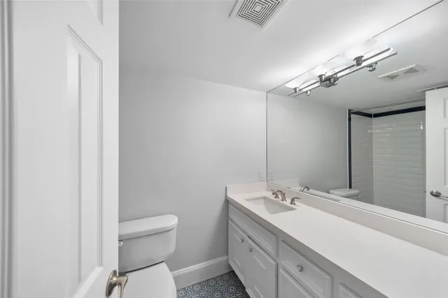 a view of a building with a yard