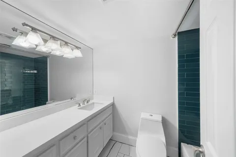 a bathroom with a shower and toilet