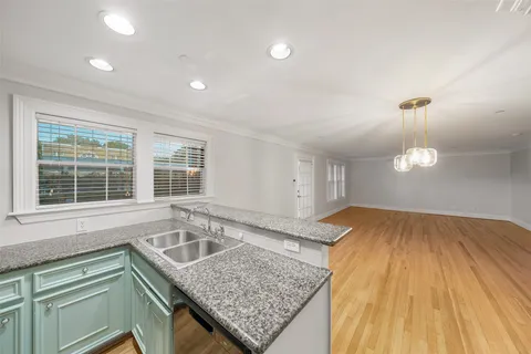 a view of a kitchen with microwave and cabinets