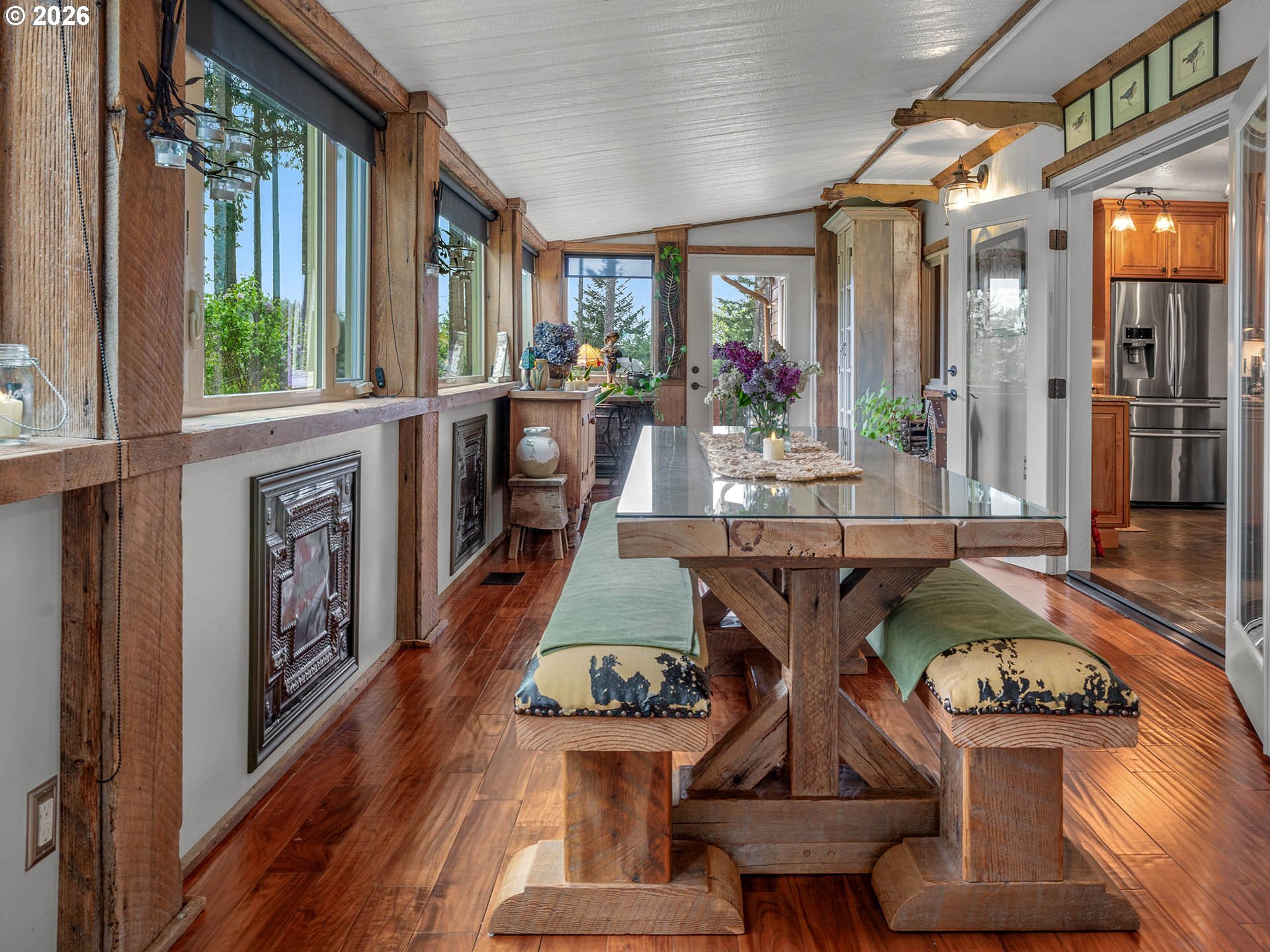 45045 Northwest Elk Mountain Road Banks, OR 97106 - Photo 14 of 48 a view of a dining room with furniture a chandelier and wooden floor