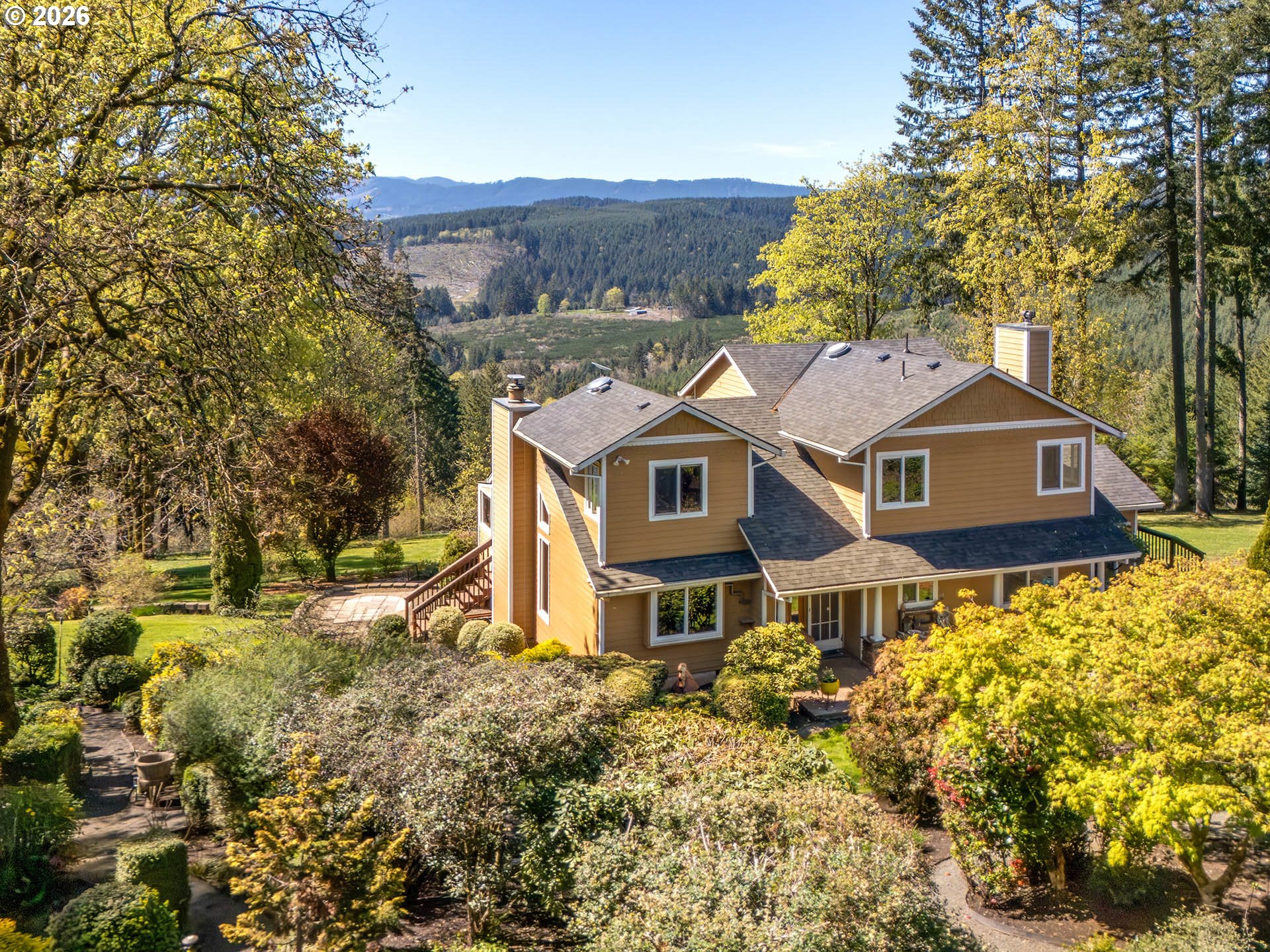 45045 Northwest Elk Mountain Road Banks, OR 97106 - Photo 2 of 48 a front view of a house with a yard