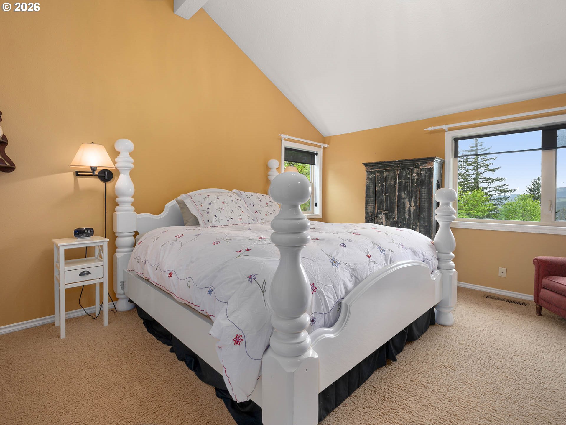 45045 Northwest Elk Mountain Road Banks, OR 97106 - Photo 22 of 48 a large bed sitting in a bedroom next to a window
