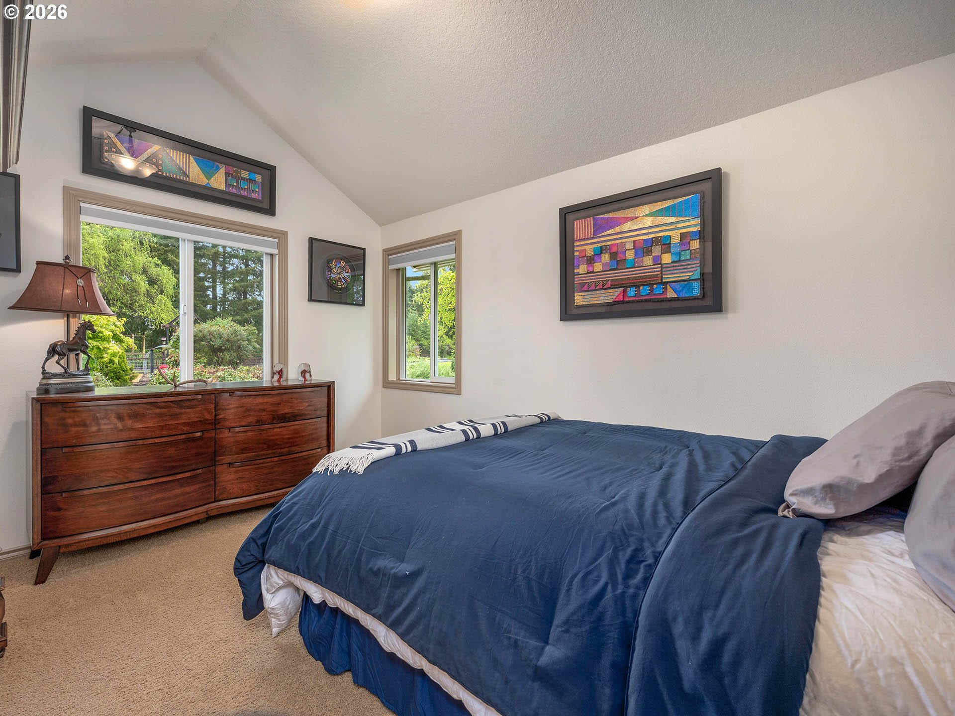 45045 Northwest Elk Mountain Road Banks, OR 97106 - Photo 26 of 48 a bed sitting in a bedroom next to a window
