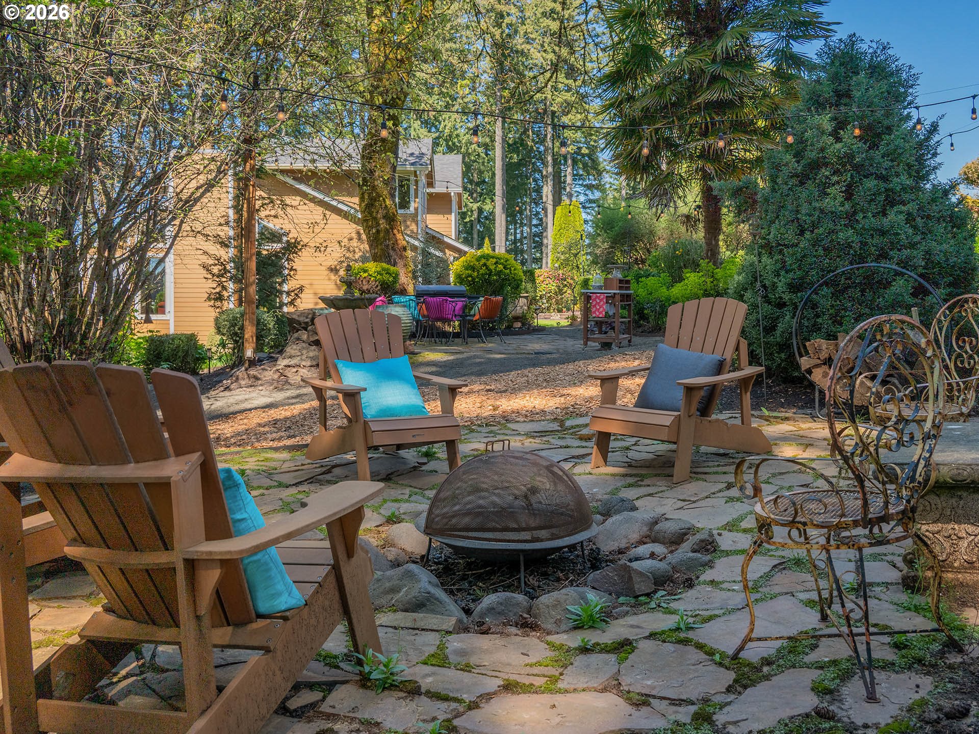 45045 Northwest Elk Mountain Road Banks, OR 97106 - Photo 29 of 48 a view of a chairs and table in backyard