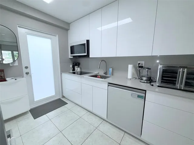 a view of a livingroom with furniture and staircase