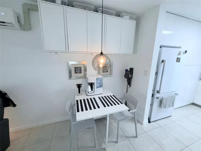 a kitchen with stainless steel appliances kitchen island granite countertop a sink and cabinets