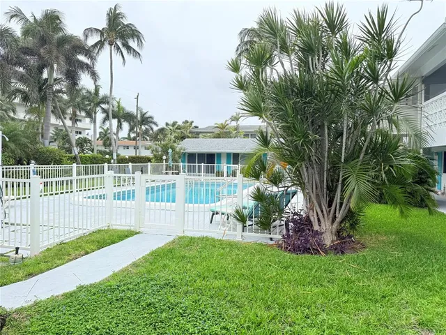 a room with a bed and a large window