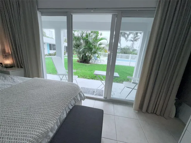 a view of backyard with outdoor seating