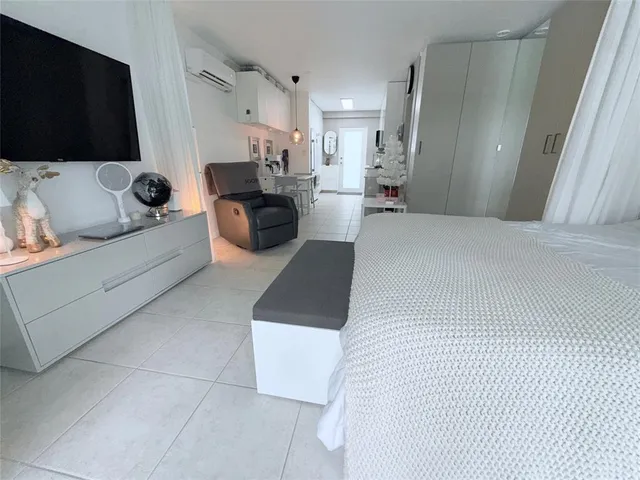 a bed room with a bed and furniture