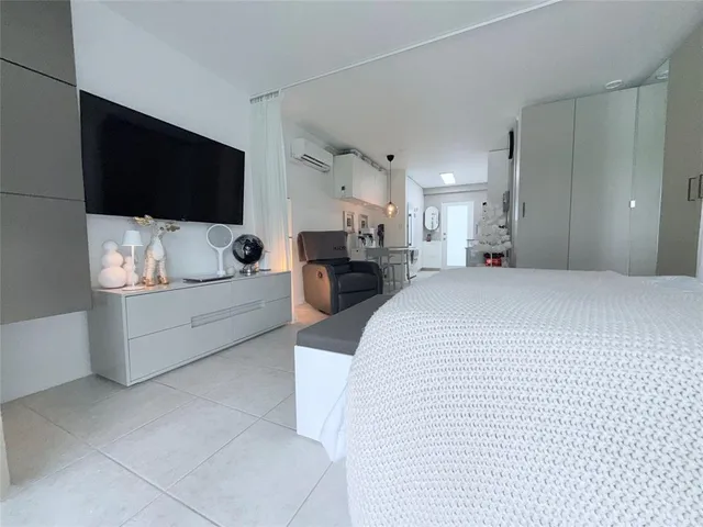 a view of a patio with table and chairs and potted plants