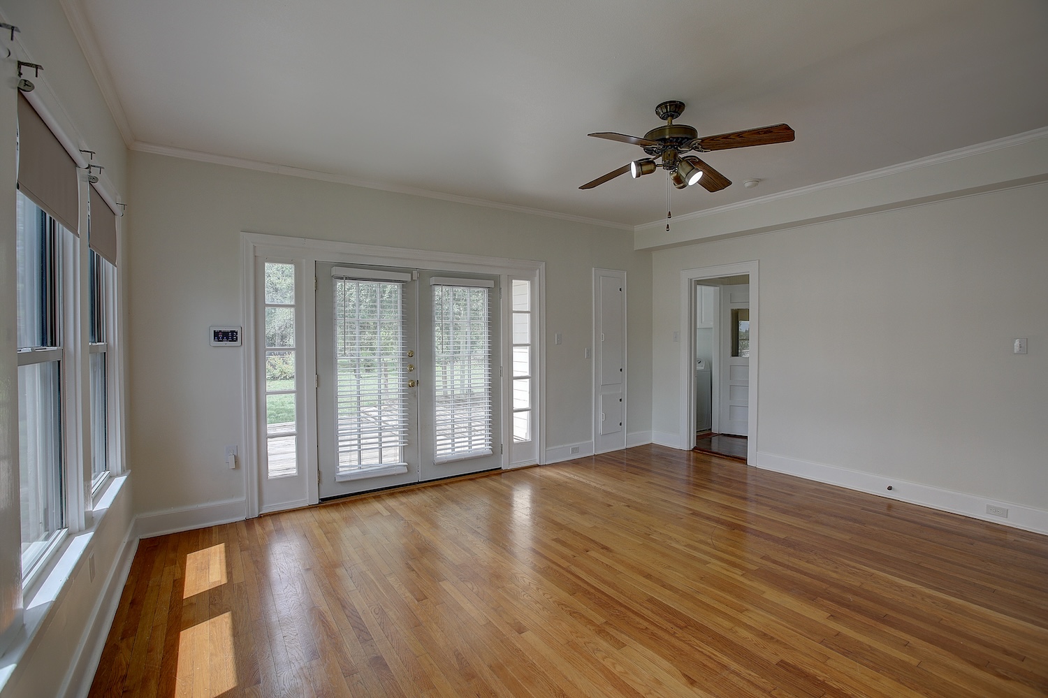 1708 Olive Street Georgetown, TX 78626 - Photo 16 of 40 a view of an empty room with a window and wooden floor