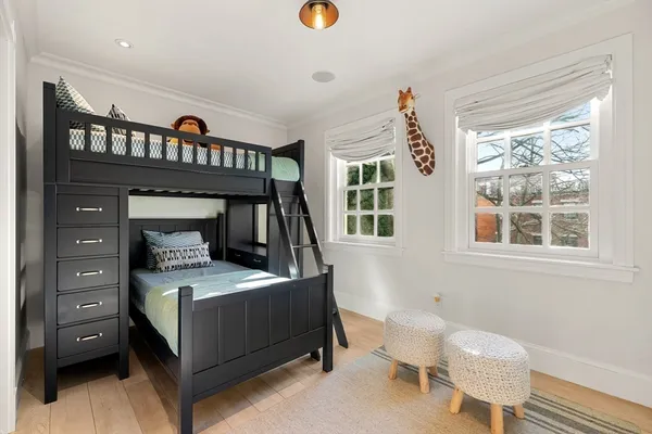 a bedroom with a bed and a dresser in it