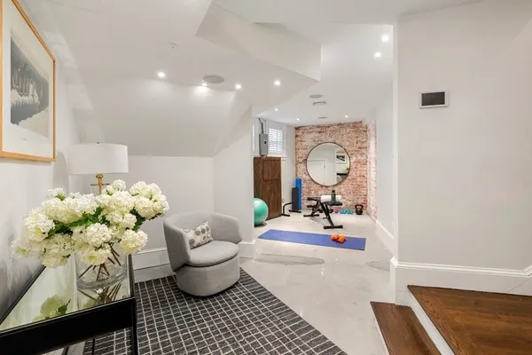 a room with lots of white furniture