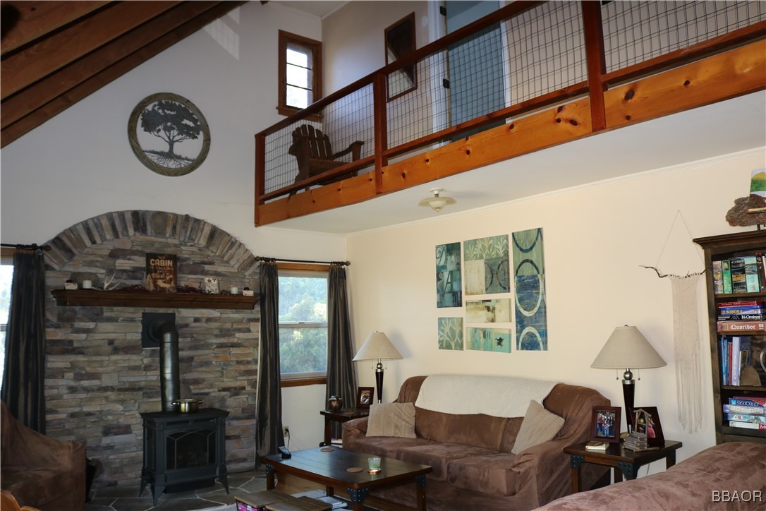 Above the living room is a balcony that leads to 2 bedrooms