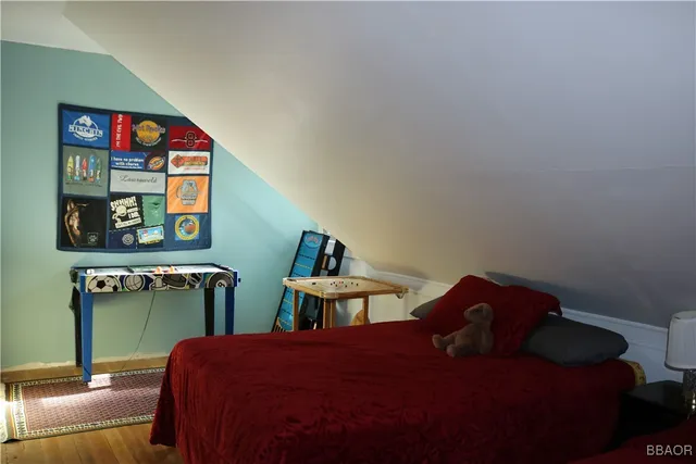 a bedroom with two beds and painted walls