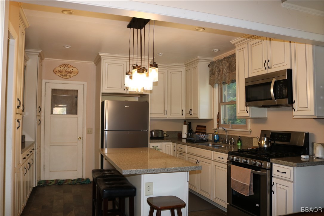 21 Holcomb Valley Road Fawnskin, CA 92333 - Photo 6 of 24 Updated kitchen with large island and the appliances stay with the purchase.