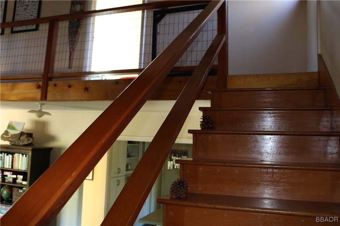 21 Holcomb Valley Road Fawnskin, CA 92333 - Photo 10 of 24 Beautiful wood stairs leading to the second floor.