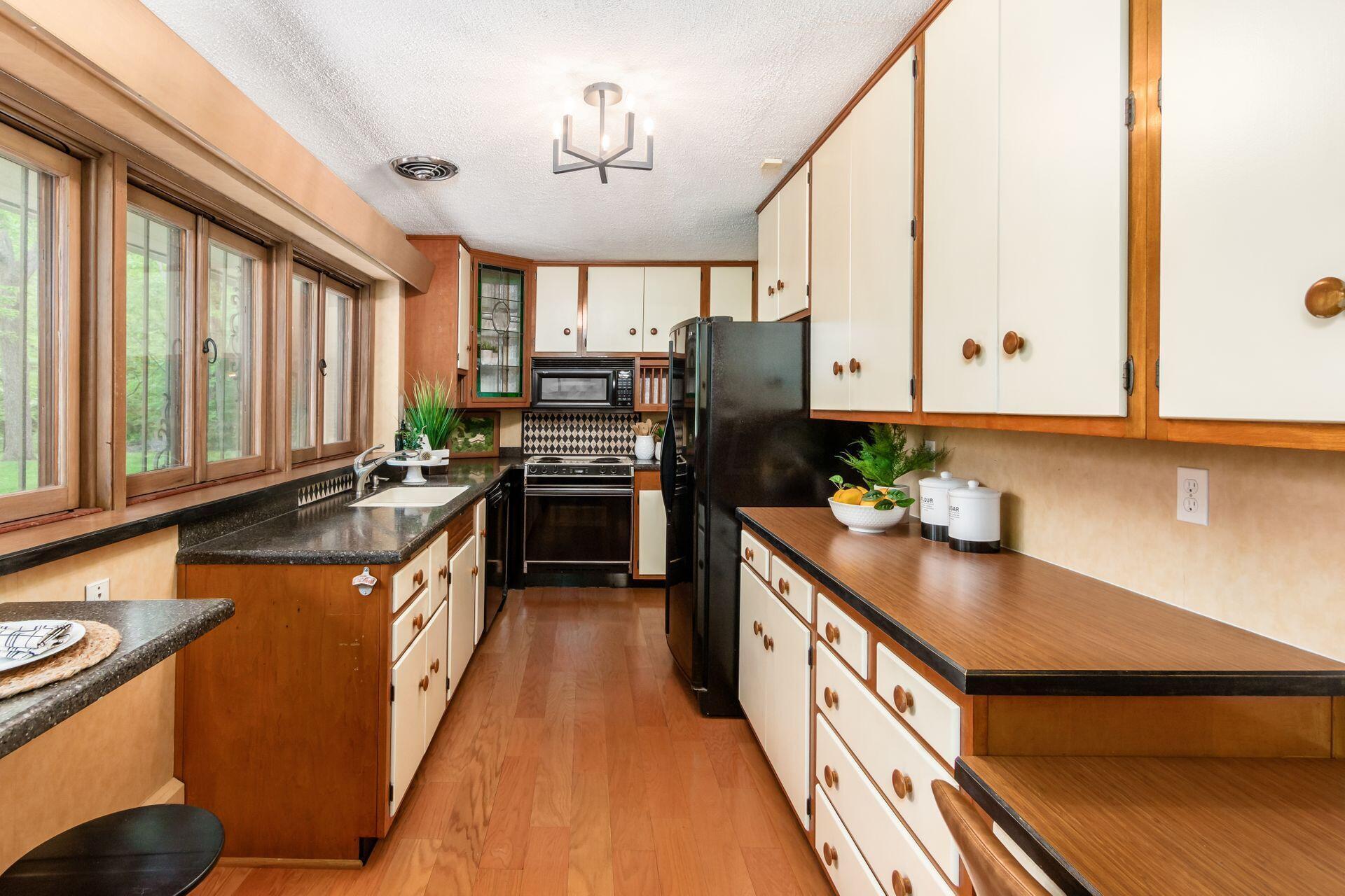 5901 Cooper Road Westerville, OH 43081 - Photo 20 of 46 Partially updated with newer countertops, painted cabinets, window ledge, sink, faucet, and lighting.