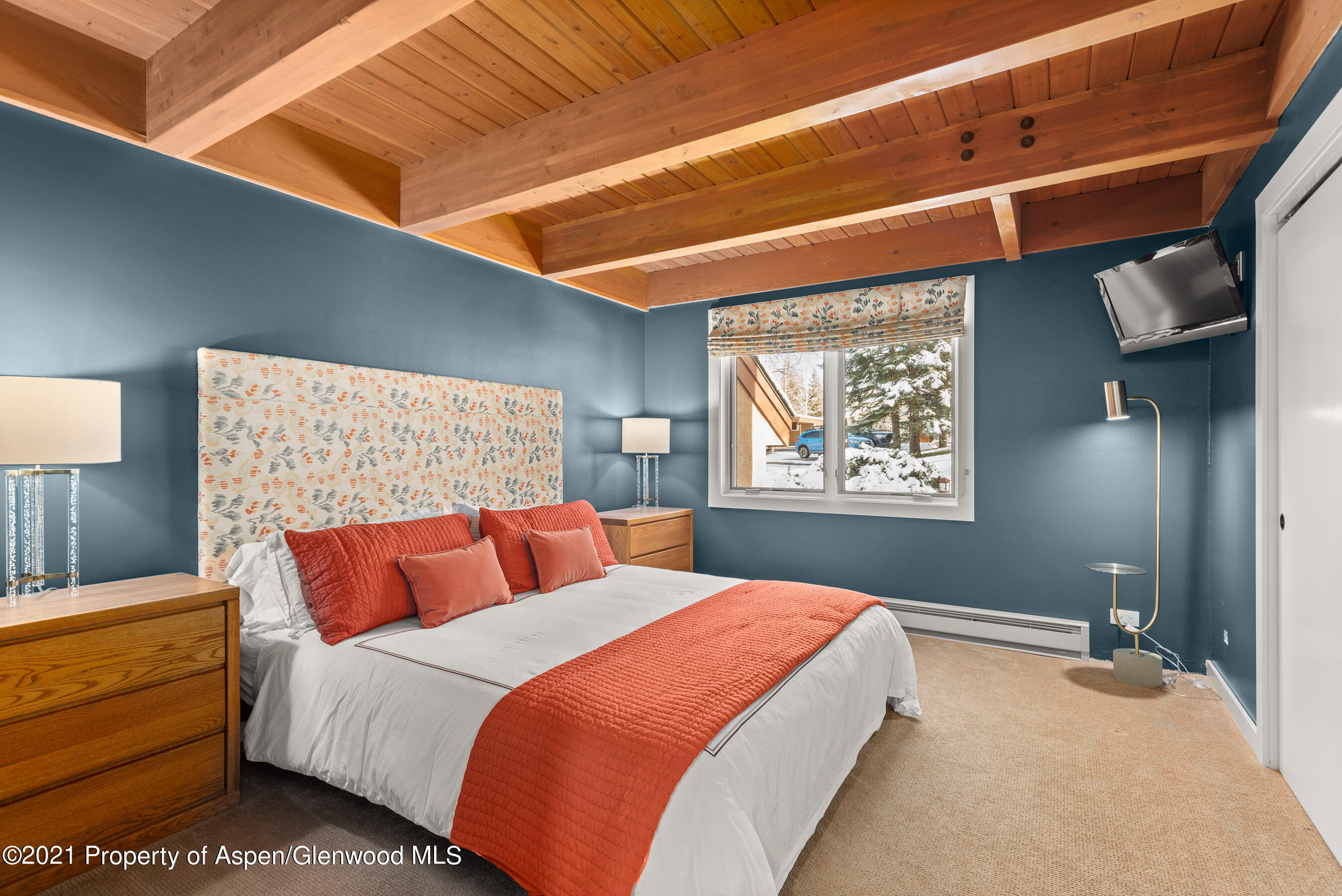 810 Ridge Road, Unit 2 Snowmass Village, CO 81615 - Photo 13 of 31 a bedroom with bed and window