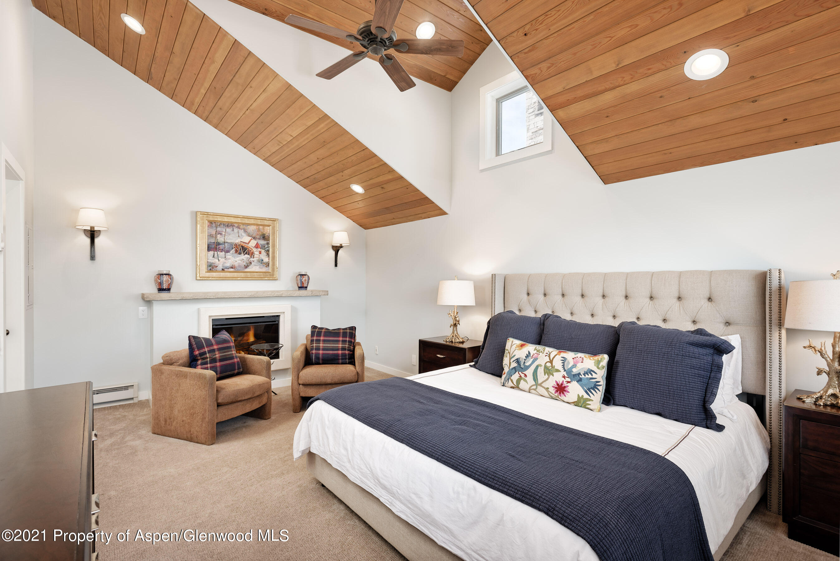 810 Ridge Road, Unit 2 Snowmass Village, CO 81615 - Photo 15 of 31 a bedroom with furniture and a large window