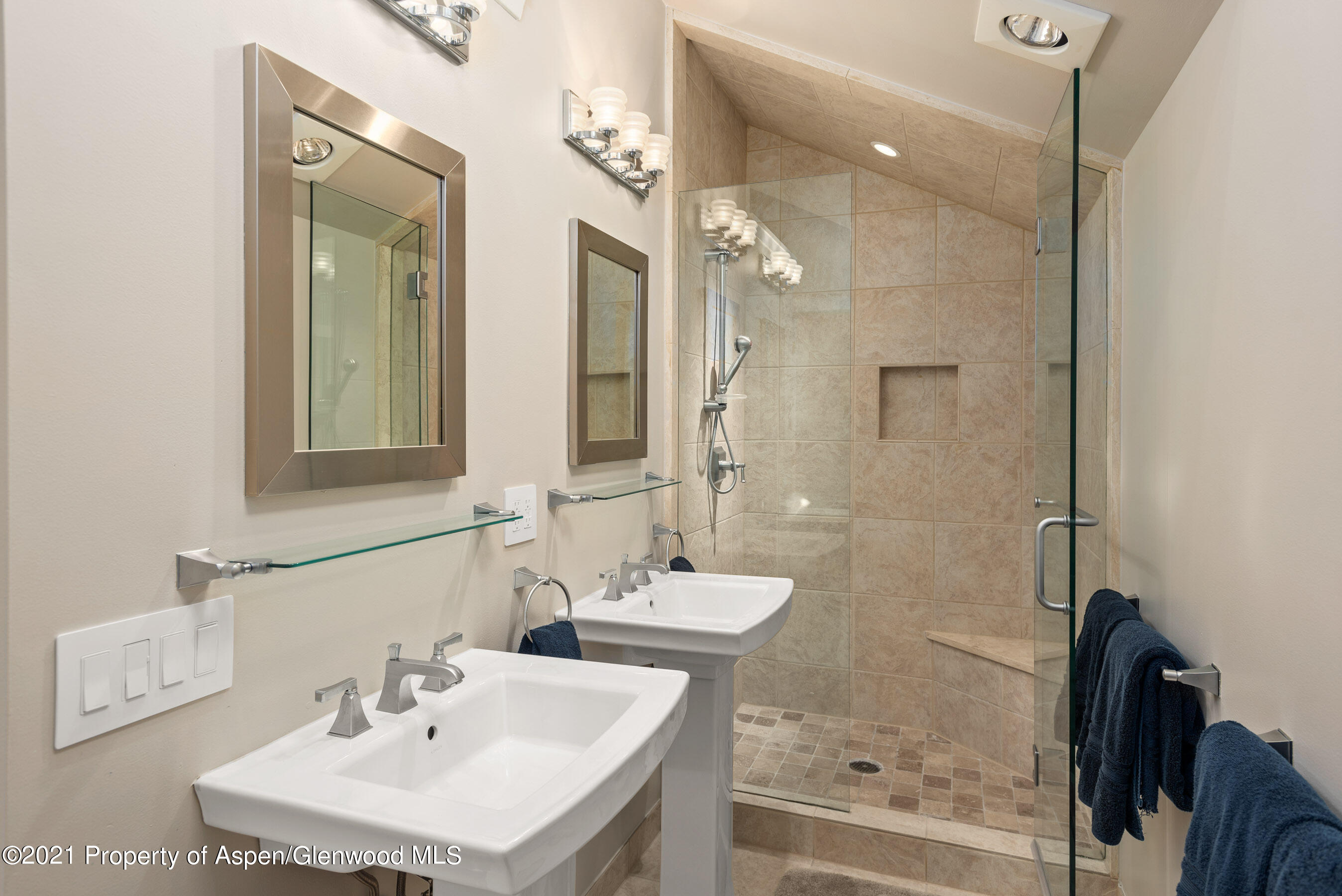 810 Ridge Road, Unit 2 Snowmass Village, CO 81615 - Photo 16 of 31 a bathroom with a sink mirror and shower
