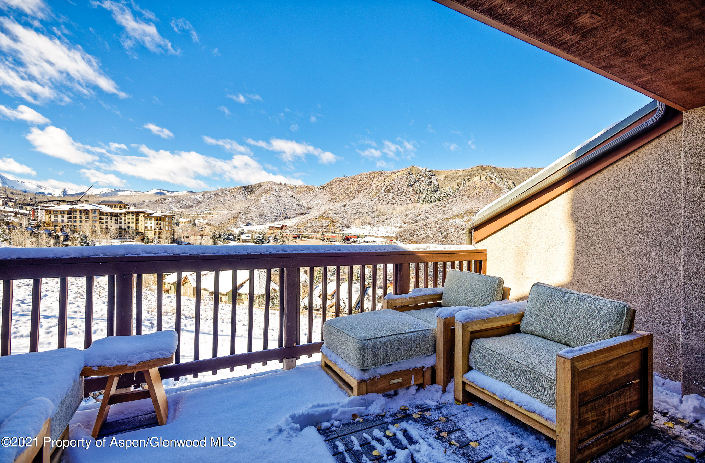 810 Ridge Road, Unit 2 Snowmass Village, CO 81615 - Photo 21 of 31 a balcony with wooden benches