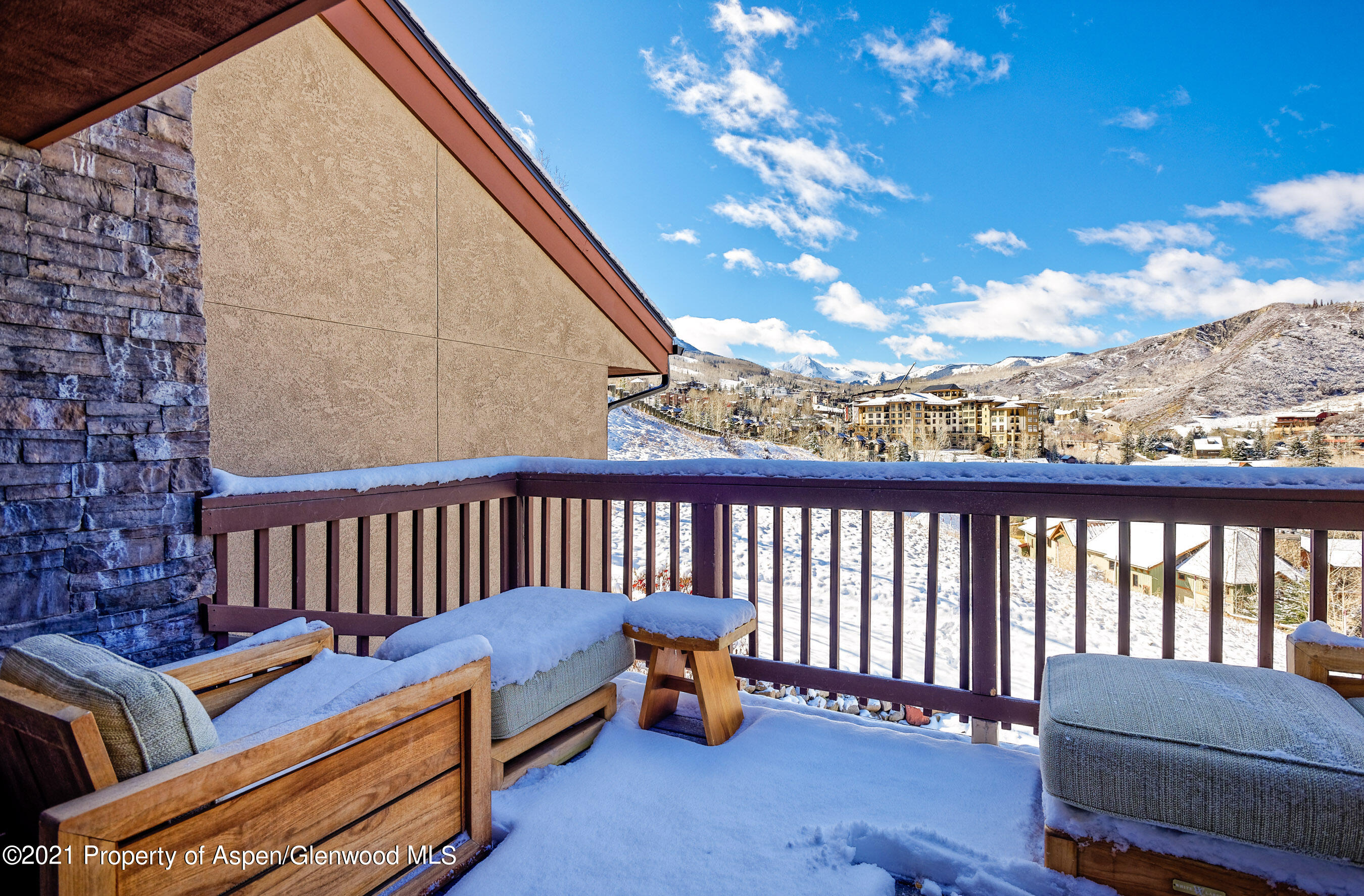 810 Ridge Road, Unit 2 Snowmass Village, CO 81615 - Photo 22 of 31 a roof deck with a couch