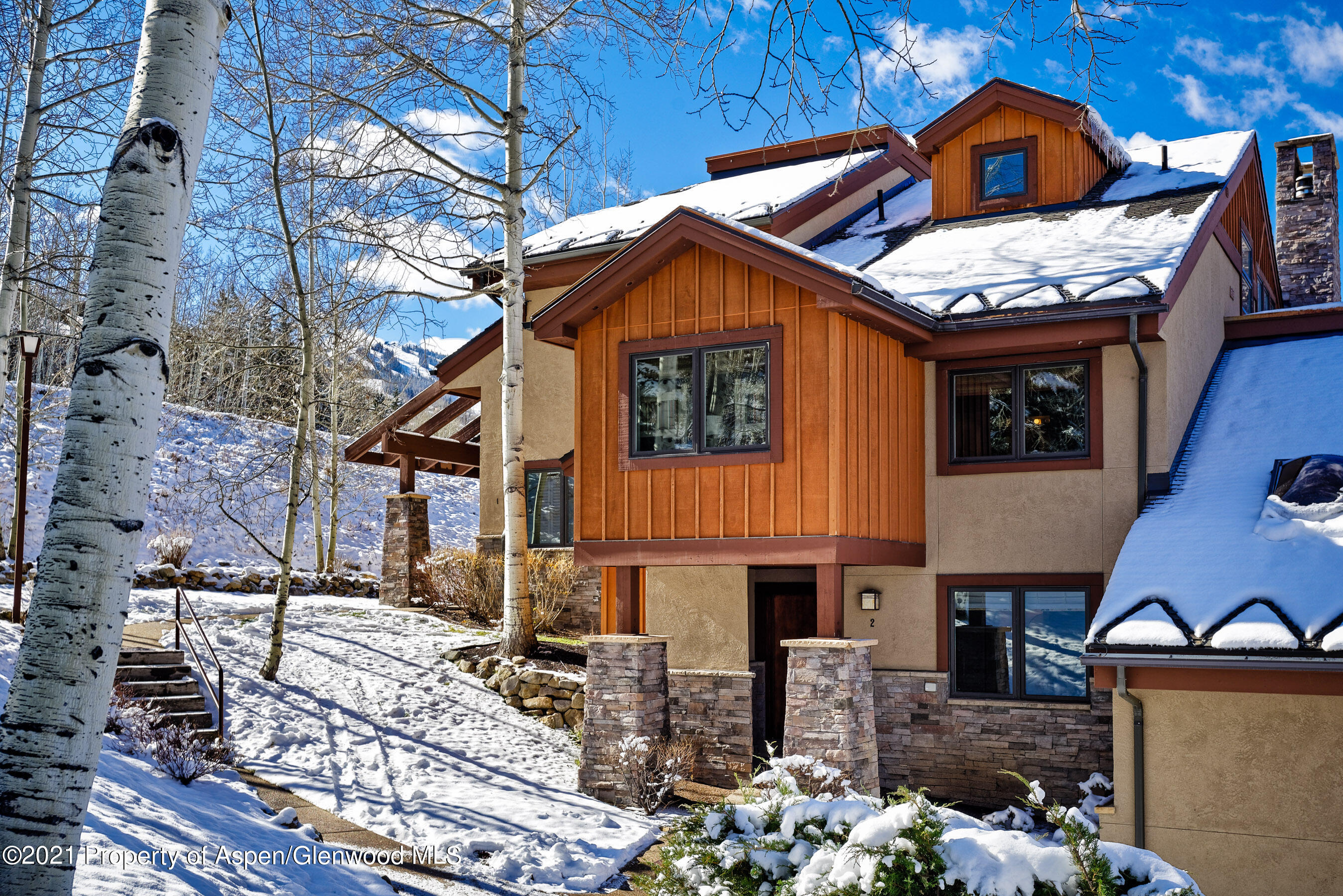 810 Ridge Road, Unit 2 Snowmass Village, CO 81615 - Photo 31 of 31 a front view of a house with balcony