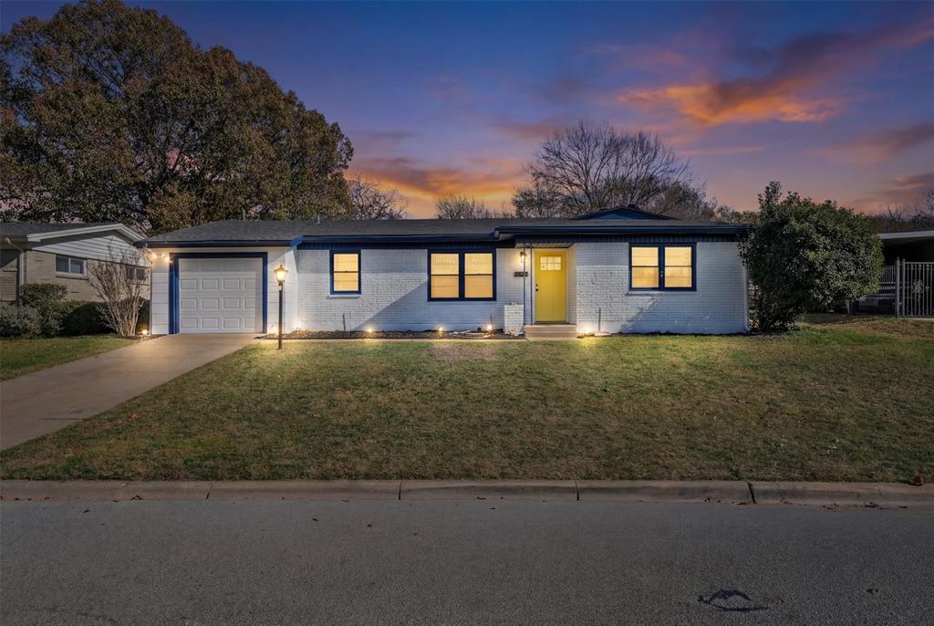 4937 Rutland Avenue Fort Worth, TX 76133 - Photo 1 of 1 Single story home with a yard, brick siding, driveway, and a garage