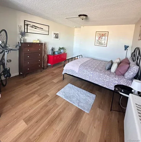 a bedroom with a bed and dresser