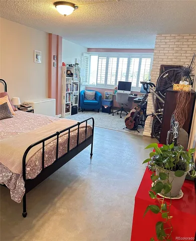 a bed room with furniture and a window