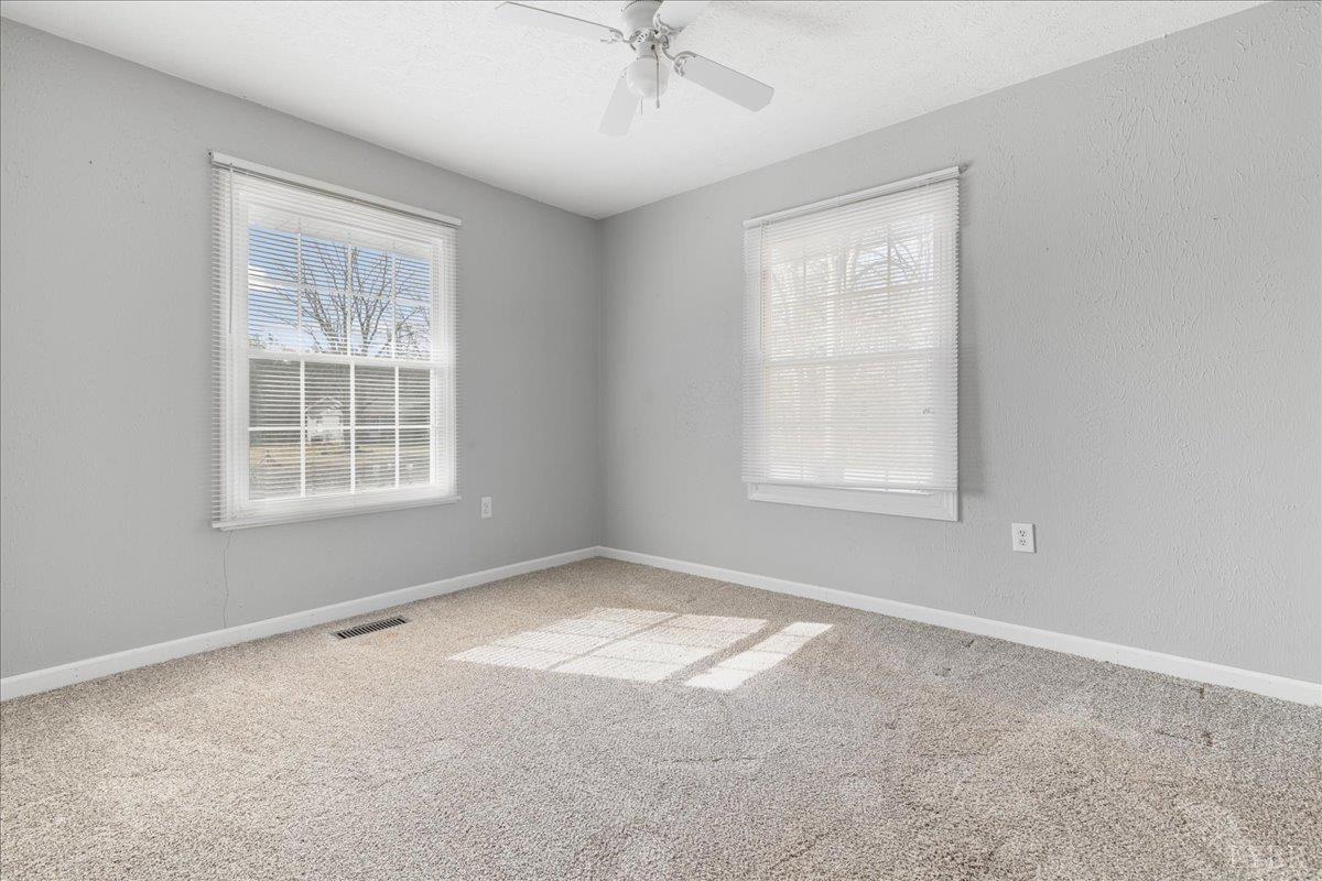 813 Doss Road Concord, VA 24538 - Photo 26 of 31 a view of a big room with windows and chandelier fan