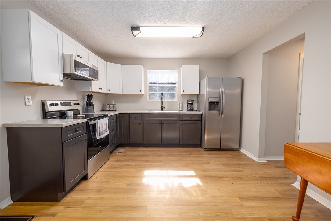 410 South Cove Road Seneca, SC 29672 - Photo 5 of 25 This spacious kitchen offers ample cabinet storage and modern stainless steel appliances.