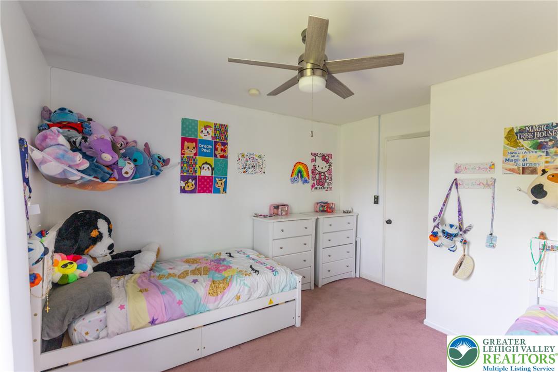 896 Briarstone Road Bethlehem, PA 18017 - Photo 13 of 26 a bedroom with a bed and a couch